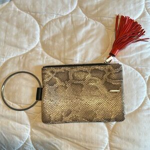 Thacker wristlet - snake print with orange tassel. Brand new without tags